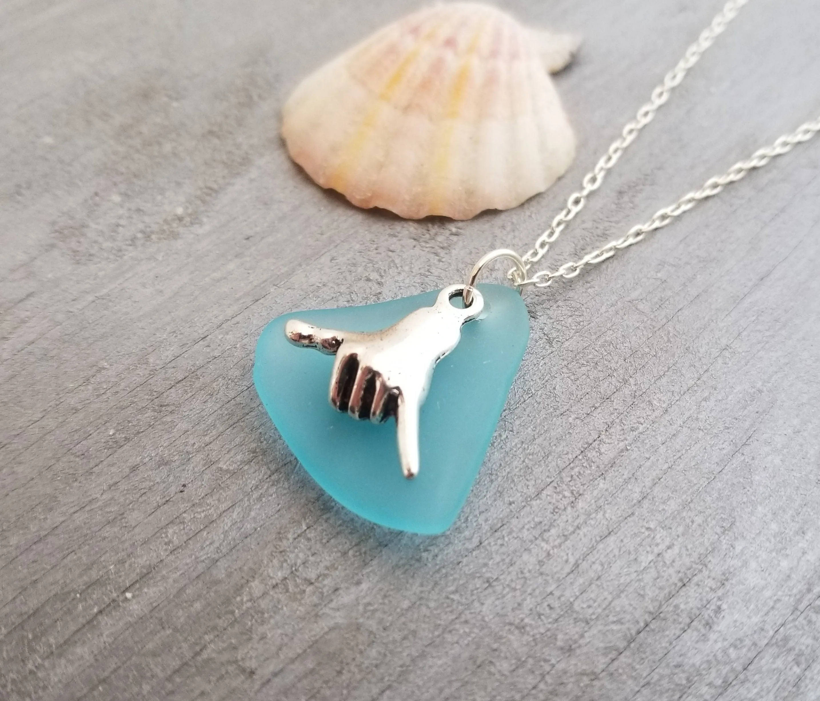 Handmade in Hawaii, Hawaii culture "Shaka - carefree attitude" sign, Turquoise Bay blue sea glass necklace, "December Birthstone" color