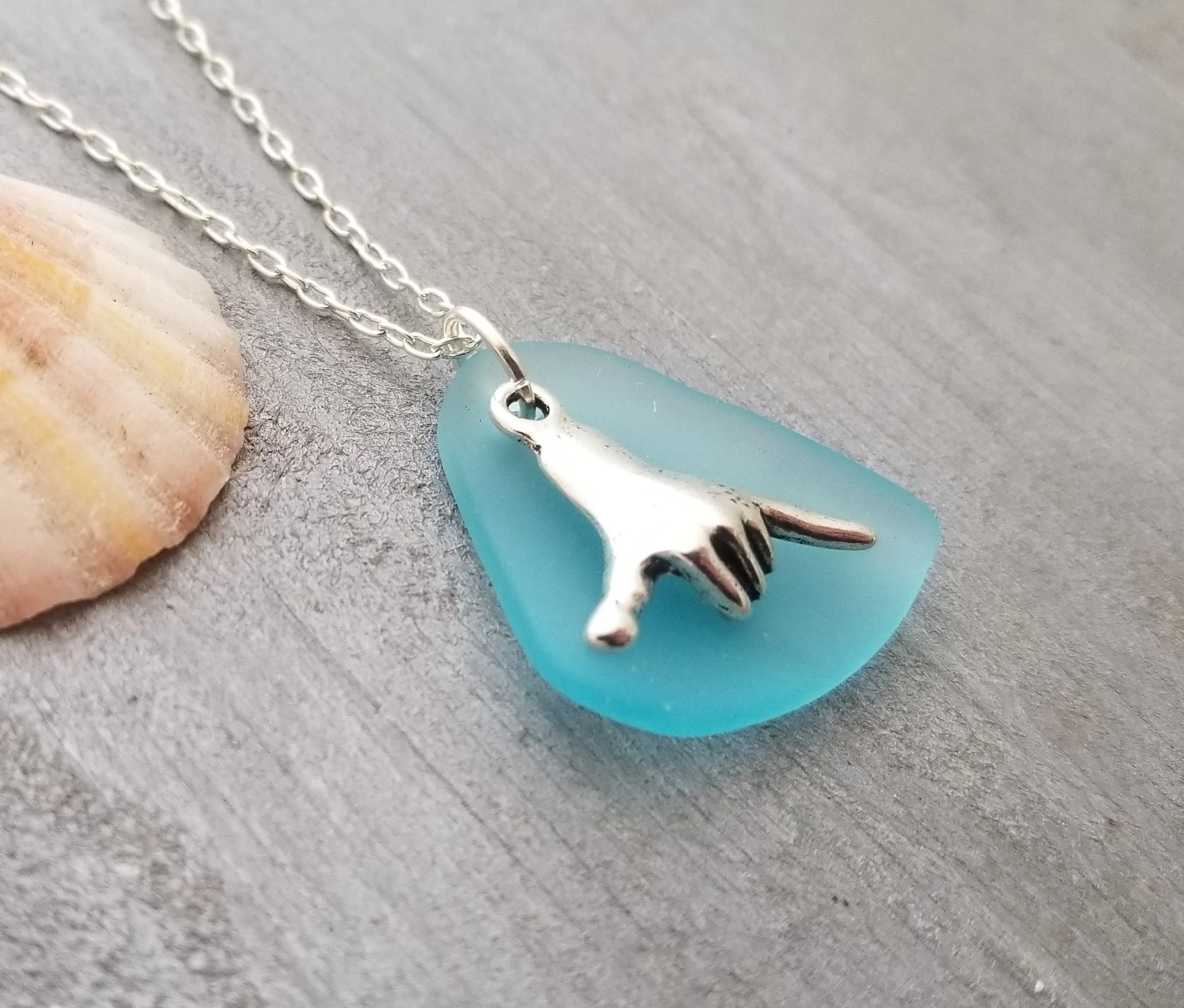 Handmade in Hawaii, Hawaii culture "Shaka - carefree attitude" sign, Turquoise Bay blue sea glass necklace, "December Birthstone" color