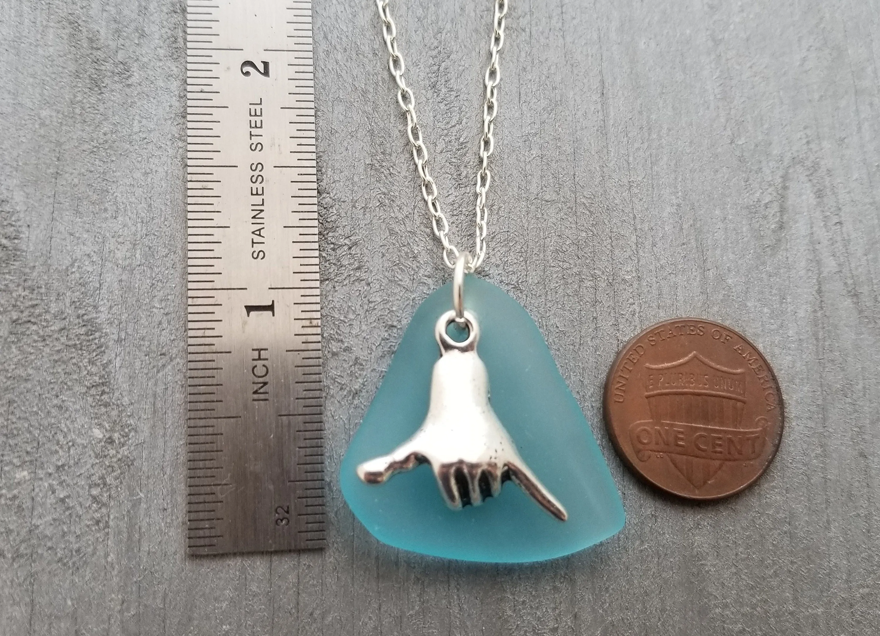 Handmade in Hawaii, Hawaii culture "Shaka - carefree attitude" sign, Turquoise Bay blue sea glass necklace, "December Birthstone" color